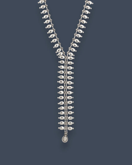 Cultural Elements silver-tone metal lariat necklace with oval and marquise-shaped links and a pendant drop.
