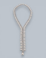 Cultural Elements silver metal lariat necklace with oval and marquise-shaped links and a teardrop pendant.