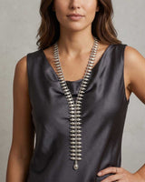 Cultural Elements silver metal lariat necklace with oval and marquise-shaped links, 26" long.