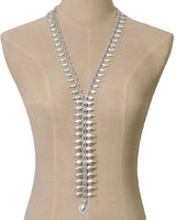 Cultural Elements silver metal lariat necklace with oval and marquise-shaped links, 26" long.