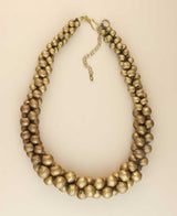 Cultural Elements antique gold-tone layered statement necklace with twisted beads and extender chain.