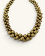 Cultural Elements antique gold-tone layered statement necklace with twisted beads and adjustable clasp.