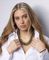 Cultural Elements gold and gunmetal-tone layered statement necklace with chunky beads and rustic finish, worn by a model.