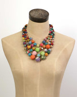 Cultural Elements multi-strand statement necklace with colorful, recycled textile beads in a layered design.