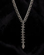 Cultural Elements antique silver tone lariat necklace with ornate Hamsa pendant and repeating links.