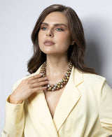 Cultural Elements mixed-tone layered statement necklace with copper, gold, and silver beads. Rustic artisanal finish.