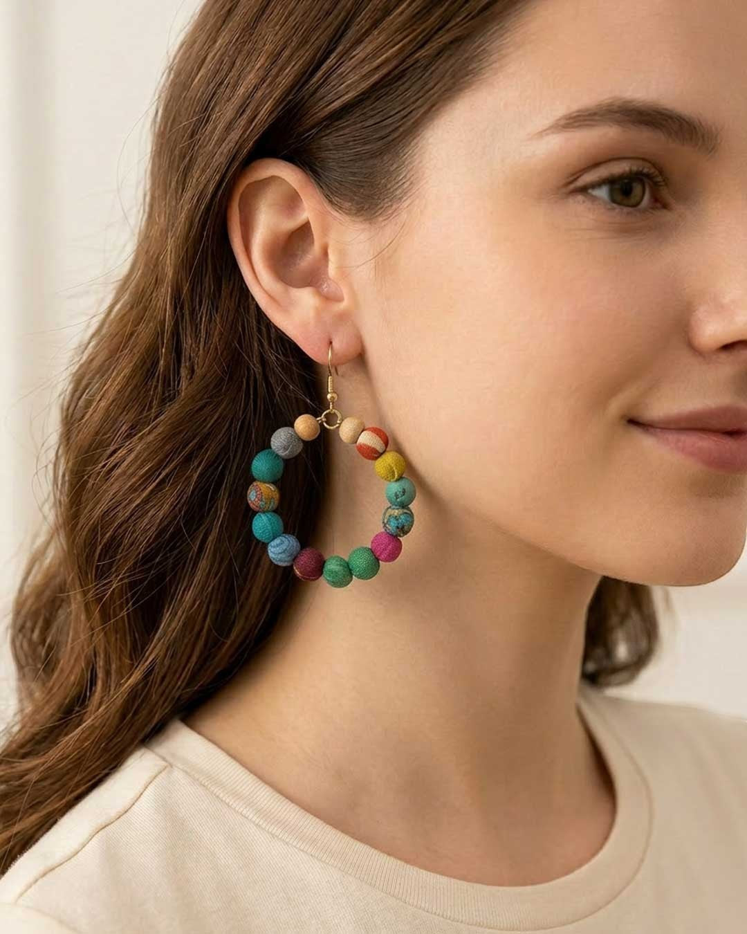 Cultural Elements multicolor fabric-wrapped beaded hoop earrings with hook closure.