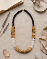 Earthform Statement Necklace – Coconut Wood, Bone & Recycled Glass — necklaces, flatlay linen lifestyle photo