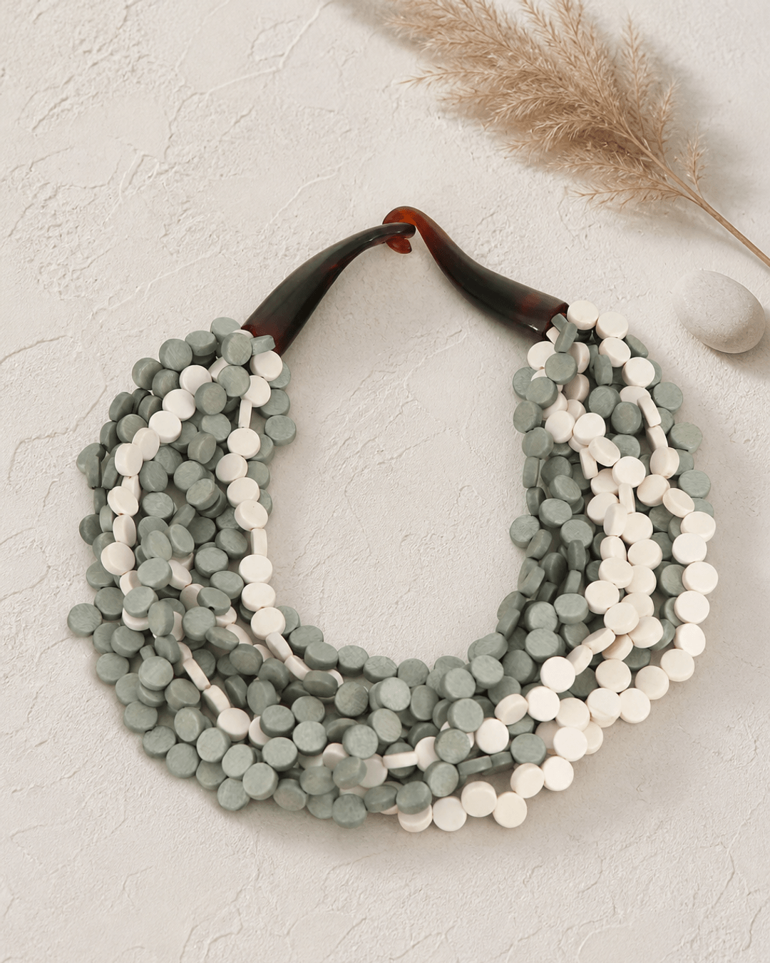 Grey and Cream Layered Necklace — necklaces, editorial plaster shadow lifestyle photo