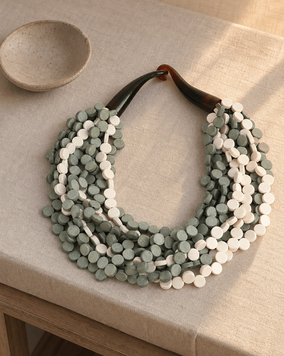 Grey and Cream Layered Necklace — necklaces, vibey rim light linen surface lifestyle photo