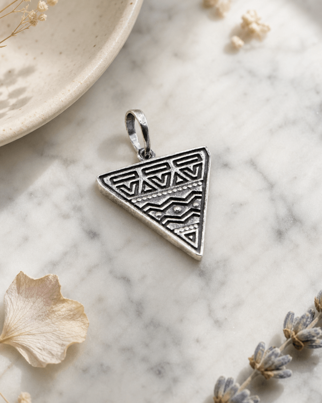 Etched Tribal Triangle Pendant — charms & pendants, editorial marble lifestyle photo