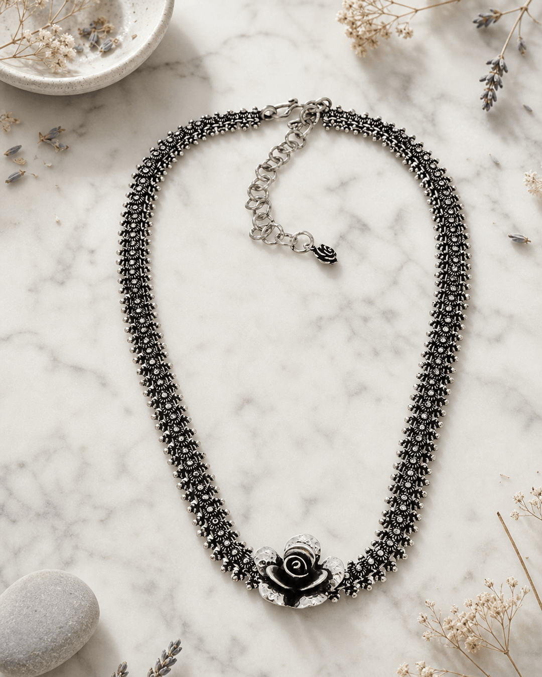 Exquisite Hill-Tribe Silver Collar Necklace with Rose Flower Centerpiece — necklaces, editorial marble lifestyle photo