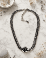 Exquisite Hill-Tribe Silver Collar Necklace with Rose Flower Centerpiece — necklaces, editorial marble lifestyle photo