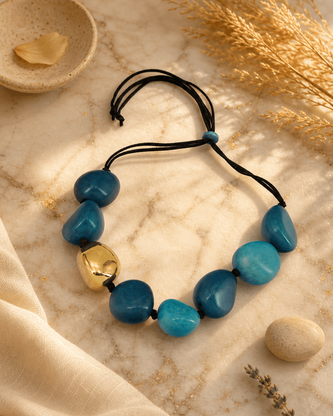 Fairtrade Handcrafted Tagua-Pods Teal Gold Statement Colombia — necklaces, editorial marble warm lifestyle photo