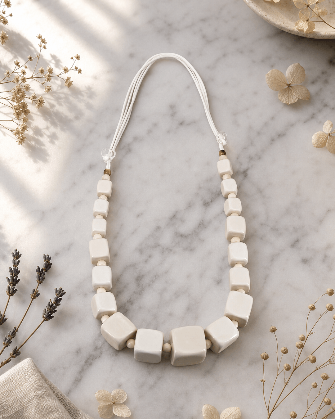 Geometric Cube Wood Necklace — necklaces, editorial marble lifestyle photo