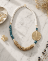 Global Medallion Statement Necklace — necklaces, editorial marble lifestyle photo
