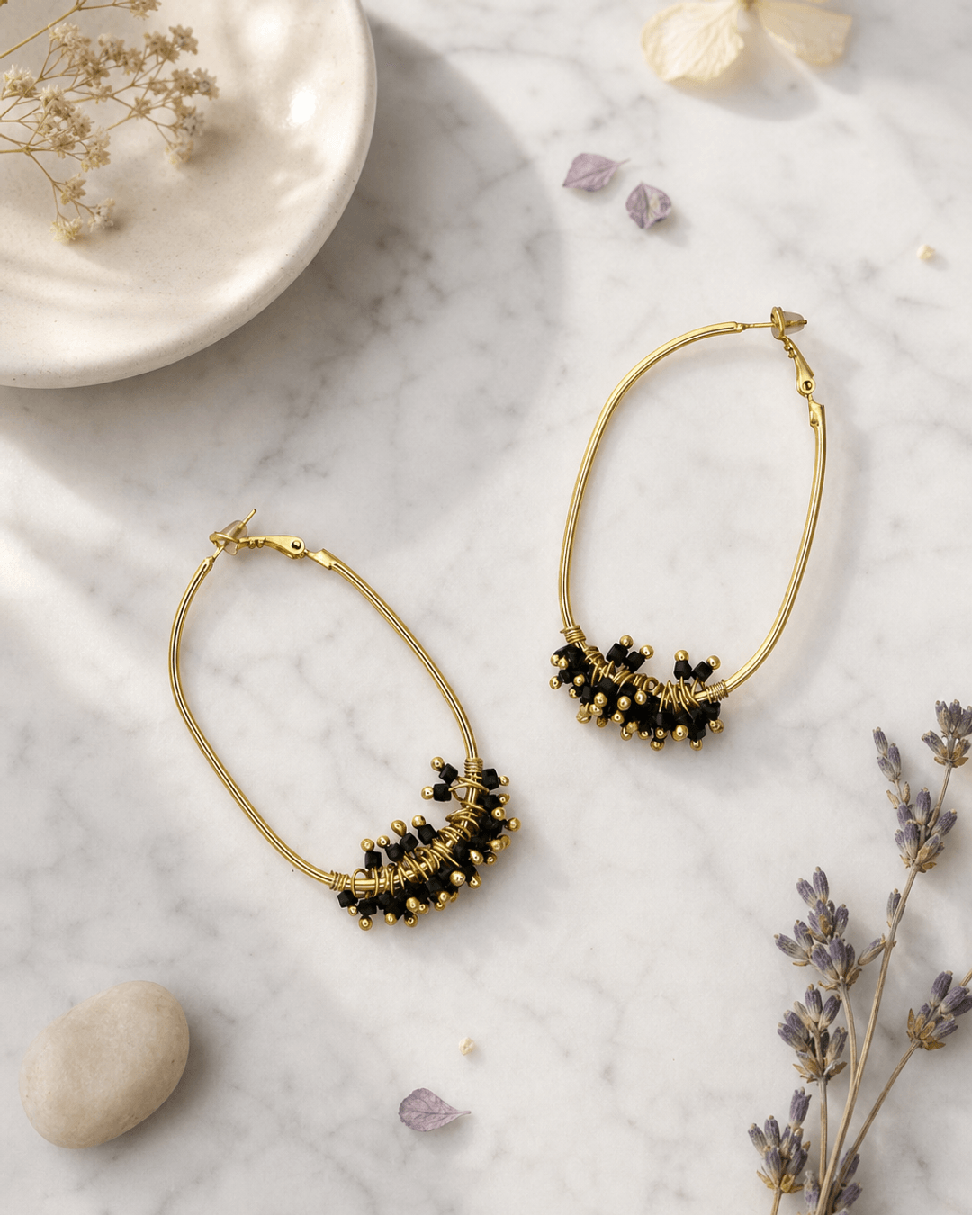 Gold-Plated Brass Hoop Earrings with Black Glass Beads — earrings, editorial marble lifestyle photo
