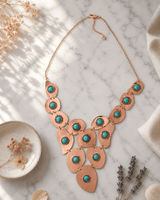 Gold-Tone Copper Necklace with Turquoise Polymer Clay Beads — necklaces, editorial marble lifestyle photo