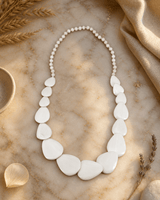 Guitar Pic Inspired Wood Necklace — necklaces, editorial marble warm lifestyle photo