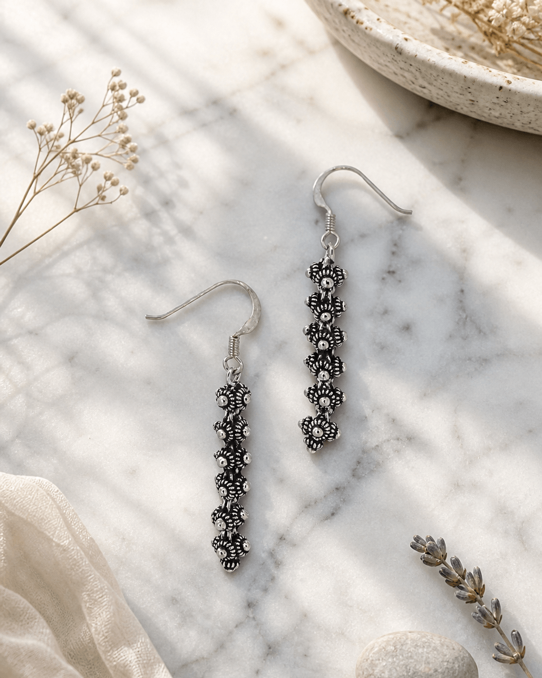 Hill Tribe Silver Detailed Floral Beaded Small Dangle Earrings, Laos — earrings, editorial marble lifestyle photo