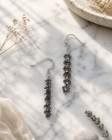 Hill Tribe Silver Detailed Floral Beaded Small Dangle Earrings, Laos — earrings, editorial marble lifestyle photo
