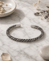 Hilltribe Sterling Silver Etched Rope-Wrapped Adjustable Cuff Bracelet — bracelets, editorial marble lifestyle photo