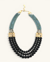 Jet glass and hematite triple strand necklace full front view on white, gold lobster clasp at top with all three bead strands shown