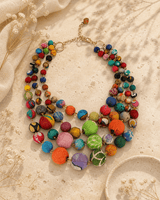 Kantha Multi-Strand Textile Wrapped Statement Necklace — necklaces, editorial travertine lifestyle photo