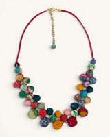 Kantha recycled textile layered bead necklace flat lay showing two strands of multicolor kantha fabric beads on a fuchsia cord