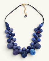 Kantha recycled sari textile bead layered necklace in indigo blue on white background, front view showing full length