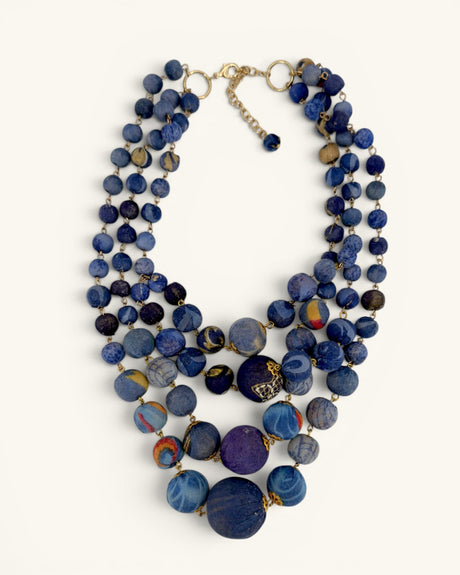 Blue kantha sari-wrapped bead statement necklace, four strands with gold hardware, full front view on white background