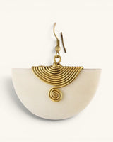 Single Kenyan hand-carved bone and brass fan earring, close-up detail view of ridged brass wire fan and spiral center element