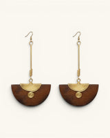 Kenyan handmade brass and wood half-moon drop earrings pair, front view on white background showing brass spiral wire detail