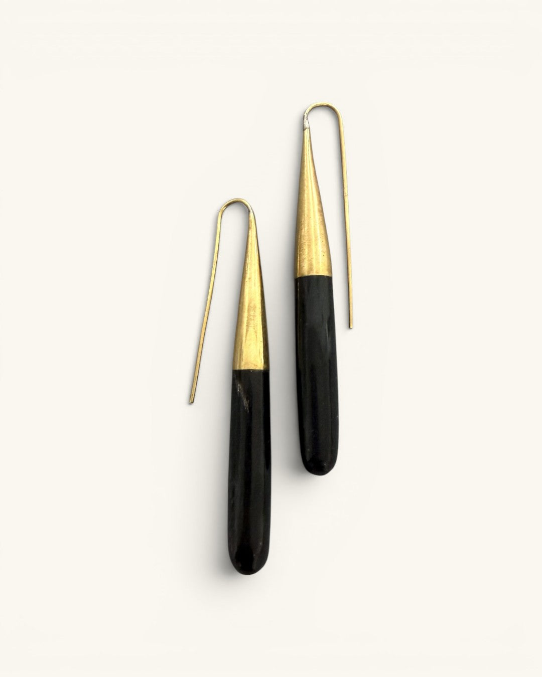 Kanai Kenyan hand-carved black horn and brass threader earrings pair on white background showing full-length front view