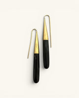 Kanai Kenyan hand-carved black horn and brass threader earrings pair on white background showing full-length front view