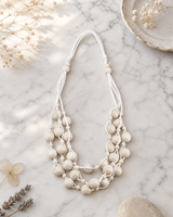 Layered Bead Wood Necklace — necklaces, editorial marble lifestyle photo