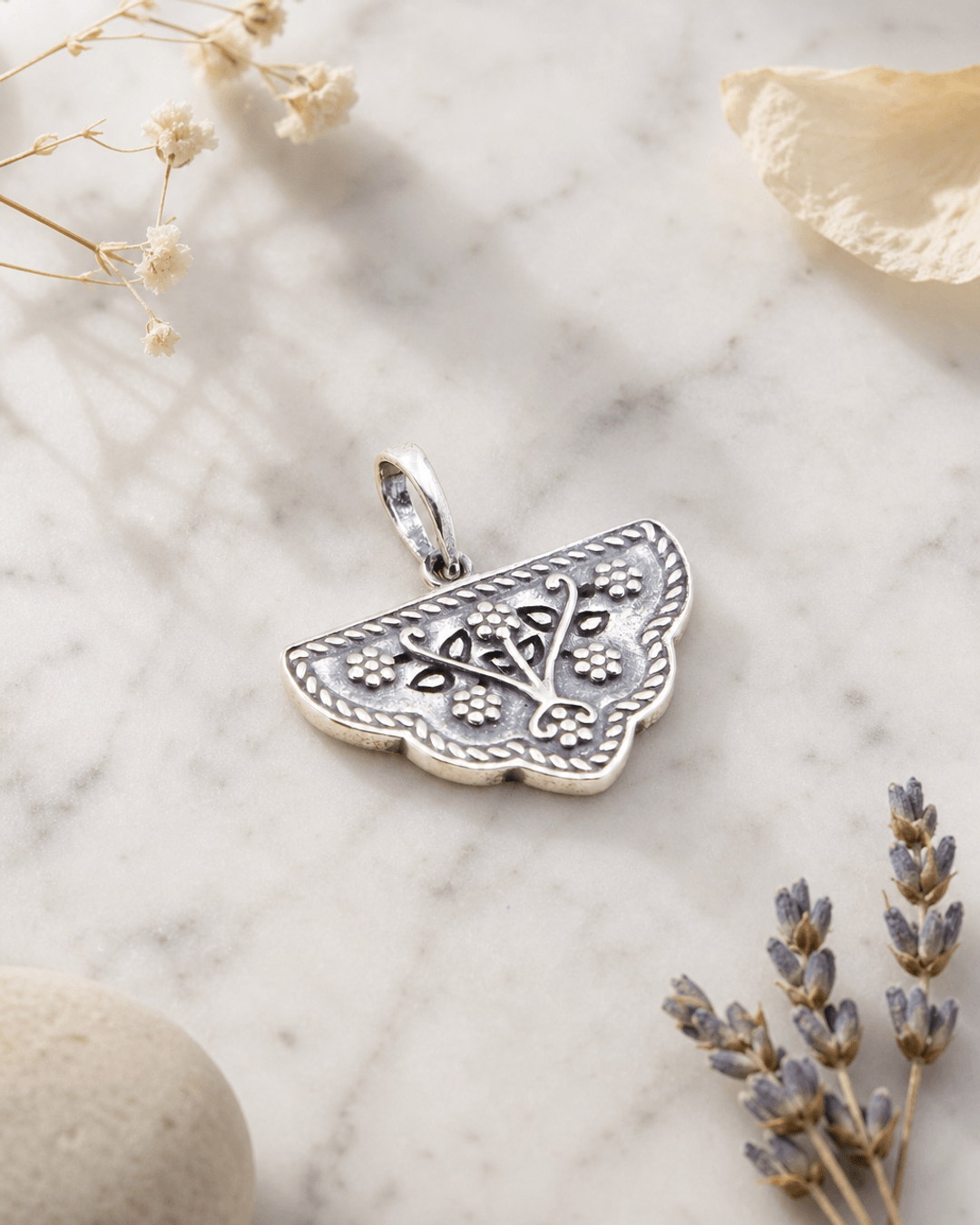 Mahal Gardens Silver Floral Pendant — charms & pendants, editorial marble lifestyle photo