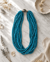 Multi-Layer Wood Beaded Necklace — necklaces, editorial marble lifestyle photo