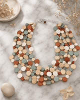 Calming Multi Layer Wood Disc Necklace — necklaces, editorial marble lifestyle photo