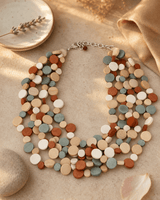 Calming Multi Layer Wood Disc Necklace — necklaces, vibey closeup lifestyle photo