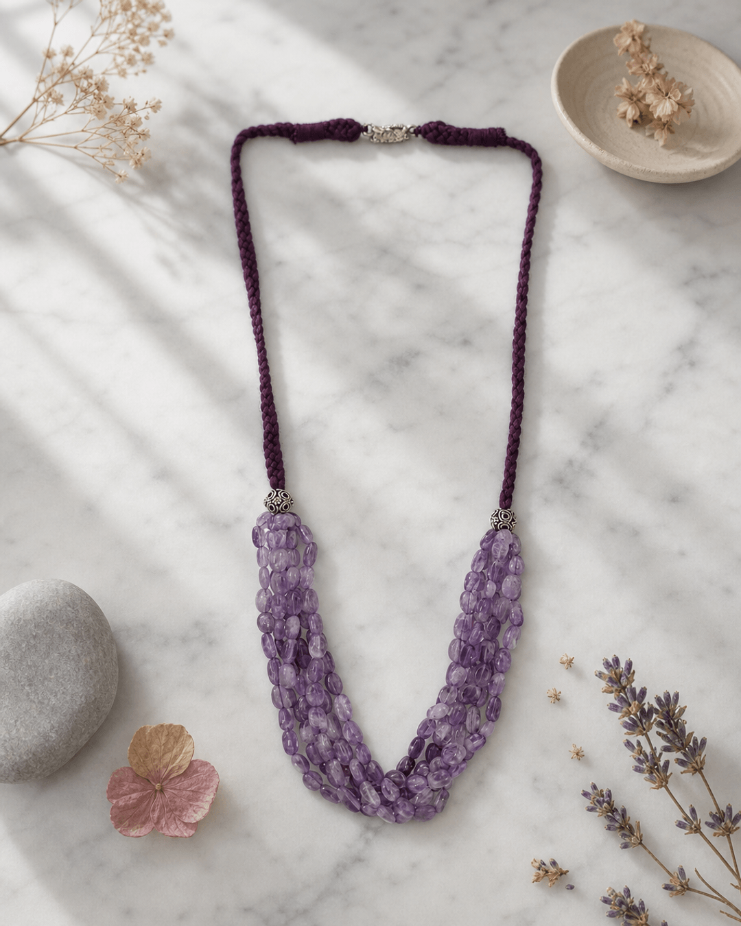 Multi-Strand Amethyst Beaded Necklace with Braided Cord — necklaces, editorial marble lifestyle photo