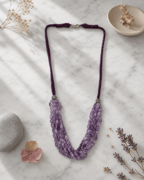 Multi-Strand Amethyst Beaded Necklace with Braided Cord — necklaces, editorial marble lifestyle photo