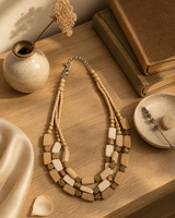 Multi-Strand Wooden Bead Necklace — necklaces, sunlit shelf lifestyle photo