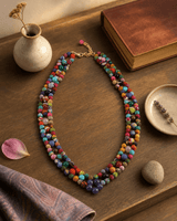 Multicolor Hand-Wrapped Textile & Gemstone Beaded Necklace — necklaces, sunlit shelf lifestyle photo