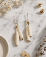 Natural Tagua Bead Tube Earrings — earrings, editorial marble lifestyle photo