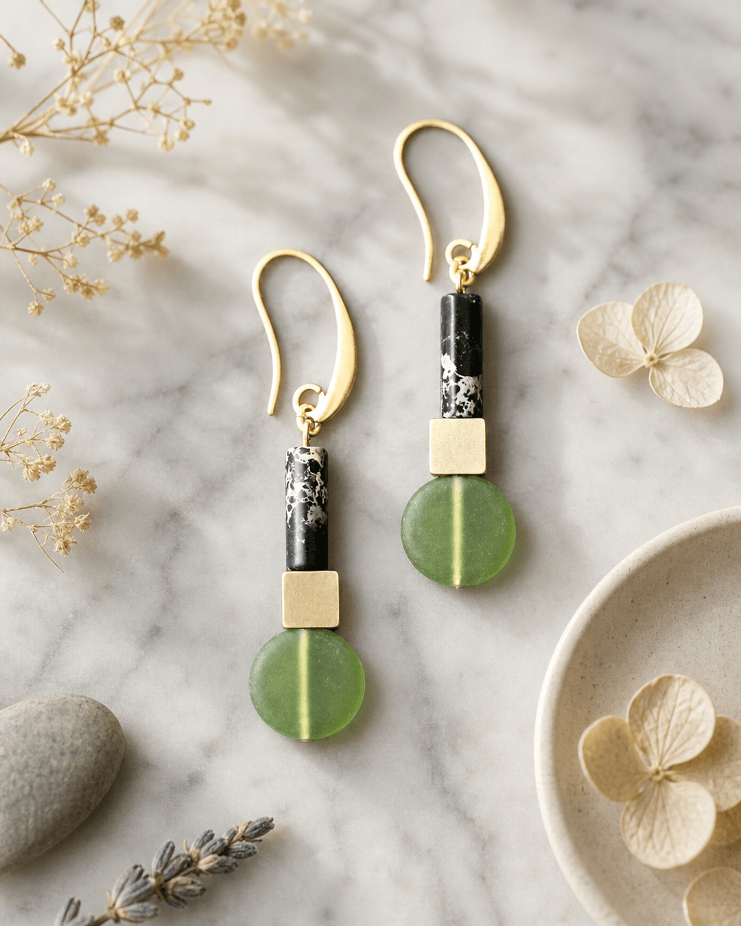 Olivine & Black Stone Drop Earrings with Gold Accents — earrings, editorial marble lifestyle photo