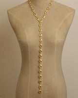 Sculpted Open Links Multi Style Necklace in gold in lariat style on dress form, highlighting the extended solid-link drop section, front view