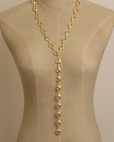 Sculpted Open Links Multi Style Necklace in gold styled as lariat Y-drop on dress form, showing full open-ring chain and long center drop