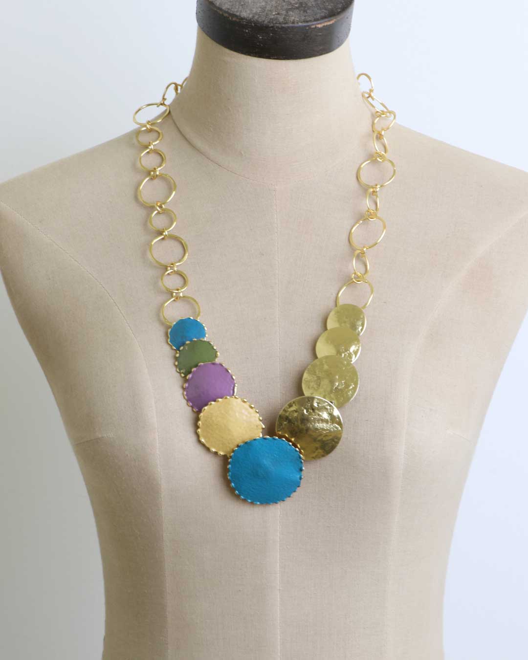 Hand-forged patina brass disc cascade necklace front view showing full length of cascading brass disc pendants and chain