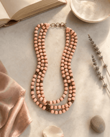 Peach-Pink Multi-Strand Wood Bead Necklace with Brass Accents — necklaces, lifestyle vanity lifestyle photo